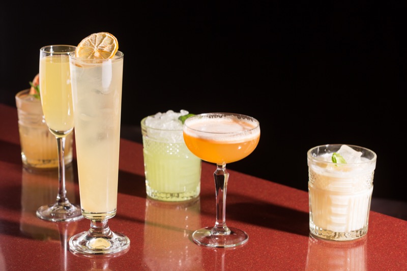 various cocktails. alcoholic drinks on a dark background